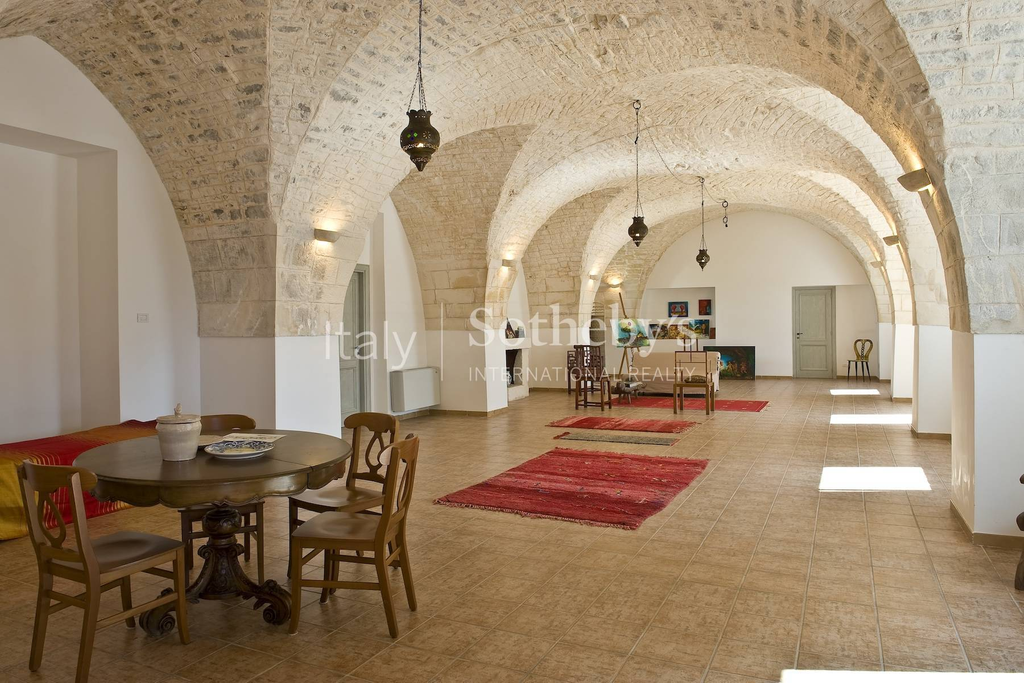 Old farmhouse with olive trees and a swimming pool
